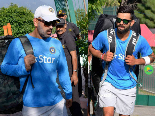 Captain Dhoni (left) and Kohli arrives for practice at HPCA Stadium in Dharamsala on Friday (October 14) Captain Dhoni (left) and Kohli arrives for practice at HPCA Stadium in Dharamsala on Friday (October 14)