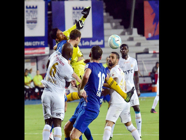Mumbai City FC and NorthEast United FC players vie for the ball during their ISL Match in Mumbai. Mumbai City FC and NorthEast United FC players vie for the ball during their ISL Match in Mumbai.