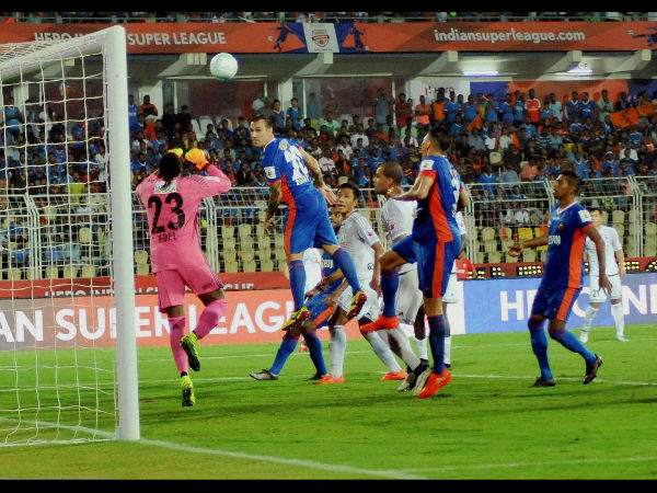 Players of FC Goa & Fc Pune City vie for the ball during their ISL match in Margao, Goa Players of FC Goa & Fc Pune City vie for the ball during their ISL match in Margao, Goa
