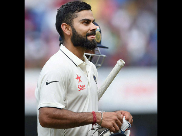 Indian batsman Virat Kohli reacts after scoring a double century on the second day of the third Test match against New Zealand in Indore on Sunday. Indian batsman Virat Kohli reacts after scoring a double century on the second day of the third Test match against New Zealand in Indore on Sunday.