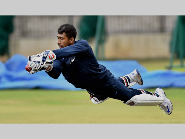 File photo: Wriddhiman Saha takes a catch during a practice session File photo: Wriddhiman Saha takes a catch during a practice session