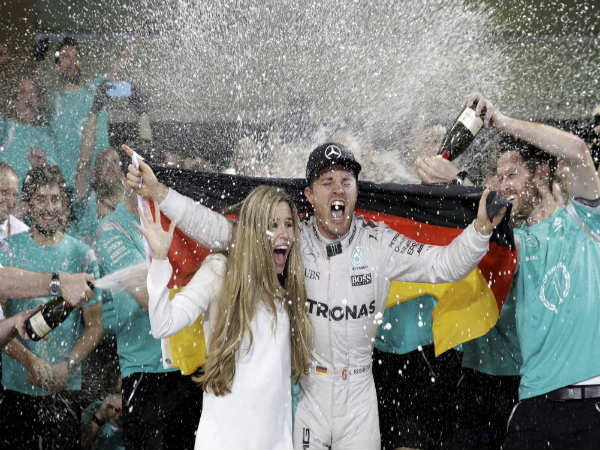 Nico Rosberg (right) celebrates after winning the F1 title Nico Rosberg (right) celebrates after winning the F1 title