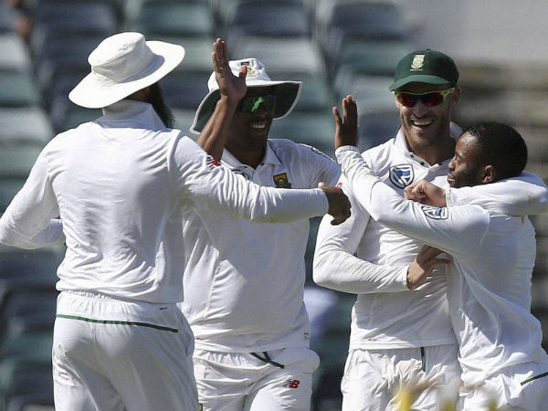 South Africa's captain Faf du Plessis, second from right, celebrates with teammate Temba Bavuma. South Africa's captain Faf du Plessis, second from right, celebrates with teammate Temba Bavuma.