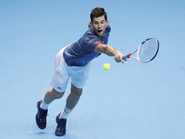 Dominic Thiem of Austria plays a return to Milos Raonic of Canada during their ATP World Tour Finals singles tennis match at the O2 Arena in London Dominic Thiem of Austria plays a return to Milos Raonic of Canada during their ATP World Tour Finals singles tennis match at the O2 Arena in London