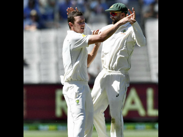 Australia's Josh Hazlewood, left, celebrates with team mate Nathan Lyon, right, capturing the wicket of Pakistan's Azhar Ali on the fifth day of their second cricket test in Melbourne Australia's Josh Hazlewood, left, celebrates with team mate Nathan Lyon, right, capturing the wicket of Pakistan's Azhar Ali on the fifth day of their second cricket test in Melbourne