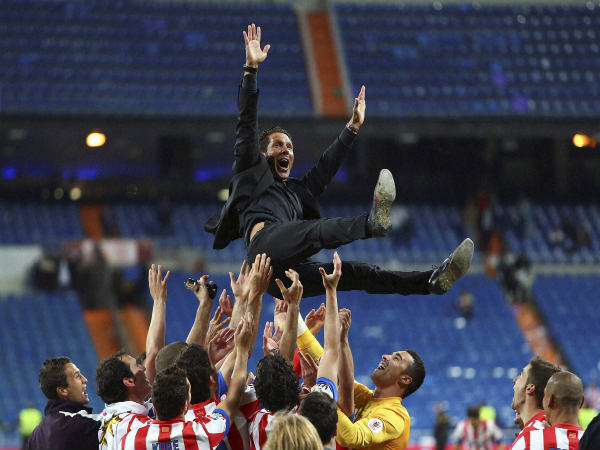 File photo: Diego Simeone (top) celebrates with team File photo: Diego Simeone (top) celebrates with team