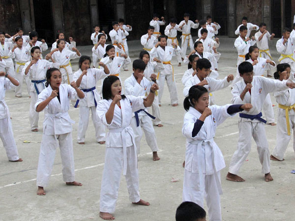 Children at a karate training camp in China's Jeyang village. Children at a karate training camp in China's Jeyang village.