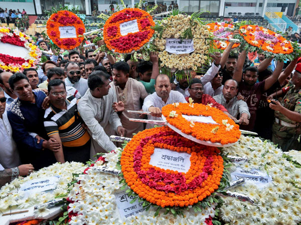 Local residents pay their respects to the victims of the attack at the Holey Artisan Bakery at a stadium in Dhaka, Bangladesh, Monday, July 4, 2016. Local residents pay their respects to the victims of the attack at the Holey Artisan Bakery at a stadium in Dhaka, Bangladesh, Monday, July 4, 2016.