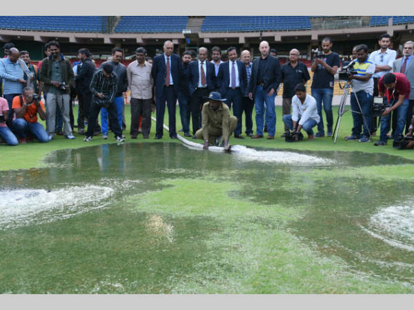A KSCA groundsman releases water onto the ground to demonstrate how the new drainage system works. A KSCA groundsman releases water onto the ground to demonstrate how the new drainage system works.