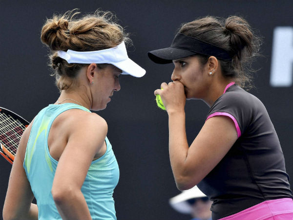 Sania Mirza (right) and Barbora Strycova talk while playing against Samantha Stosur and Zhang Shuai at the Australian Open on Friday (January 20) Sania Mirza (right) and Barbora Strycova talk while playing against Samantha Stosur and Zhang Shuai at the Australian Open on Friday (January 20)