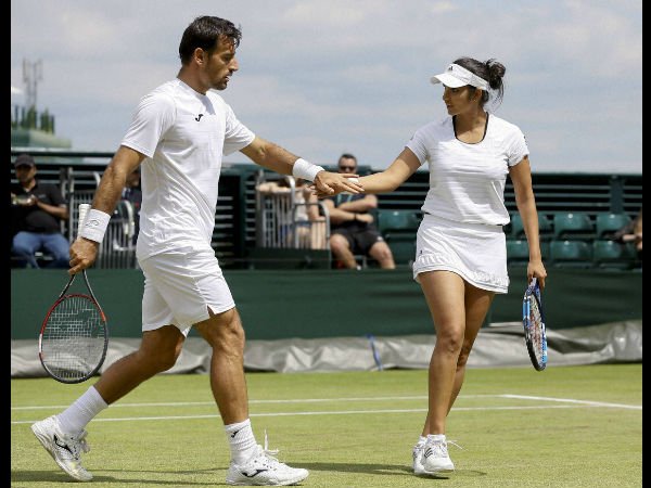 Australian Open: Sania Mirza edges past compatriot Rohan Bopanna in mixed doubles to enter semis Australian Open: Sania Mirza edges past compatriot Rohan Bopanna in mixed doubles to enter semis