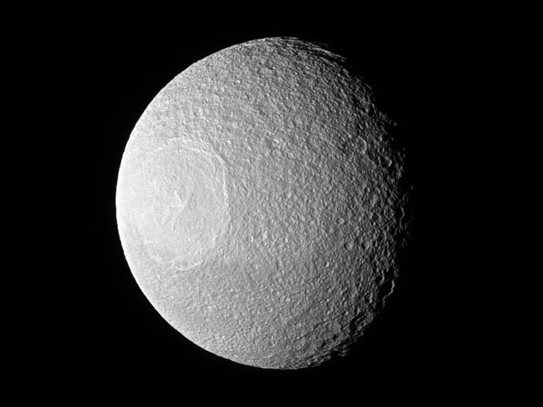 Saturn has over 60 moons, so it's no wonder some of them trigger our human sense of pareidolia. Saturn has over 60 moons, so it's no wonder some of them trigger our human sense of pareidolia.