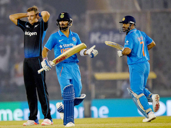 Dhoni (right) and Kohli (centre) run between the wickets as New Zealand bowler Tim Southee watches during a ODI in Mohali in October 2016 Dhoni (right) and Kohli (centre) run between the wickets as New Zealand bowler Tim Southee watches during a ODI in Mohali in October 2016