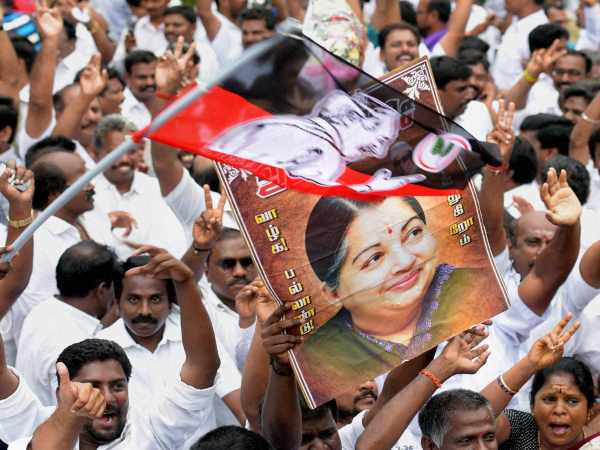 AIADMK supporters celebrating after party chief J Jayalalithaa was cleared of corruption charges by Karnataka high court in disproportionate assets case, at her residence in Chennai in this photograph taken on May 11, 2015 AIADMK supporters celebrating after party chief J Jayalalithaa was cleared of corruption charges by Karnataka high court in disproportionate assets case, at her residence in Chennai in this photograph taken on May 11, 2015
