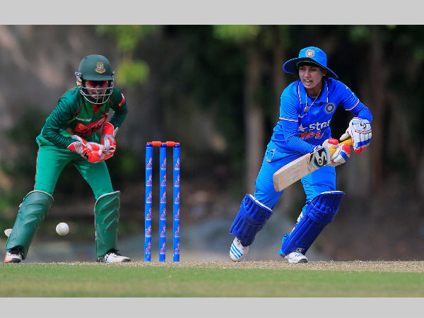 Mithali Raj plays a shot as Nigar Sultana Joty watches during their ICC Women's World Cup Qualifier one-day match Mithali Raj plays a shot as Nigar Sultana Joty watches during their ICC Women's World Cup Qualifier one-day match