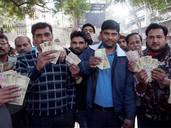 People showing their old currency notes outside the Reserve Bank of India when they could not exchange the banned currency notes, in New Delhi. People showing their old currency notes outside the Reserve Bank of India when they could not exchange the banned currency notes, in New Delhi.