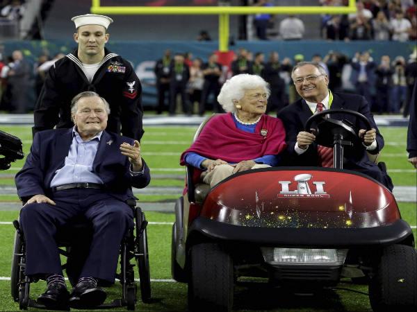 Former President George H.W. Bush and wife Barbara on the field before the NFL Super Bowl Former President George H.W. Bush and wife Barbara on the field before the NFL Super Bowl