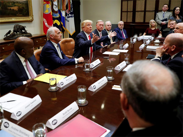 President Donald Trump gestures while speaking during his meeting with health insurance company executives in the Roosevelt Room of the White House in Washington. President Donald Trump gestures while speaking during his meeting with health insurance company executives in the Roosevelt Room of the White House in Washington.