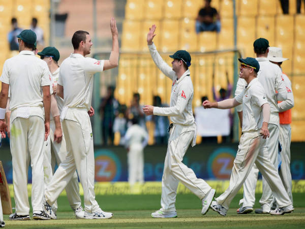 Josh Hazlewood (left) celebrates with teammates after picking Virat Kohli's wicket Josh Hazlewood (left) celebrates with teammates after picking Virat Kohli's wicket