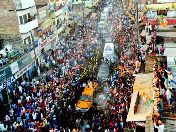 Prime Minister Narendra Modi during his road show in Varanasi. Photo credit: PTI Prime Minister Narendra Modi during his road show in Varanasi. Photo credit: PTI