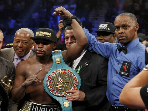 File photo: Floyd Mayweather with his title belt File photo: Floyd Mayweather with his title belt