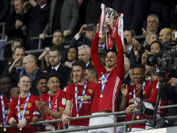 File photo: Manchester United players with EFL Cup trophy File photo: Manchester United players with EFL Cup trophy