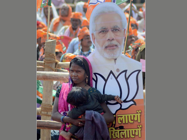 A woman supporter at Prime Minister Narendra Modi's election campaign rally in favour of BJP candidates in Mirzapur A woman supporter at Prime Minister Narendra Modi's election campaign rally in favour of BJP candidates in Mirzapur