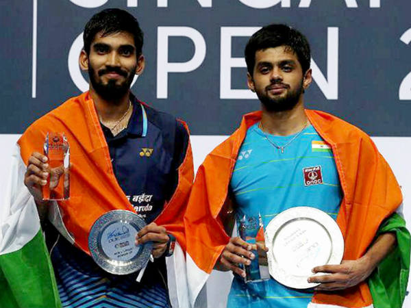 Sai Praneeth (right) and Srikanth pose with their trophies after the Singapore Open final Sai Praneeth (right) and Srikanth pose with their trophies after the Singapore Open final