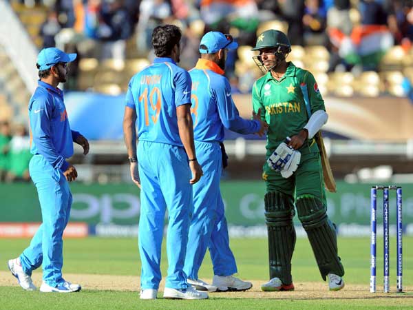 Indian players shake hands with Shadab Khan