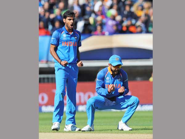 Bhuvneshwar Kumar (left) and Virat Kohli