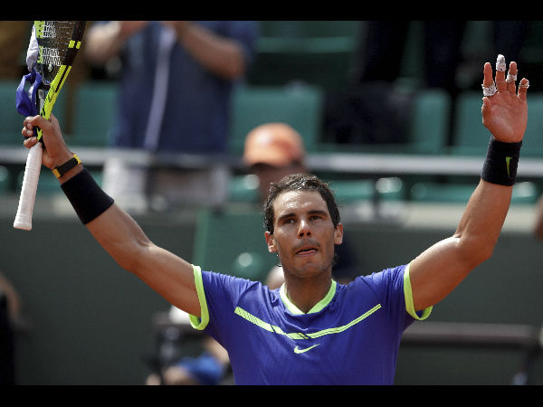 Spain's Rafael Nadal celebrates after defeating France's Benoit Paire during their first round match of the French Open. Spain's Rafael Nadal celebrates after defeating France's Benoit Paire during their first round match of the French Open.