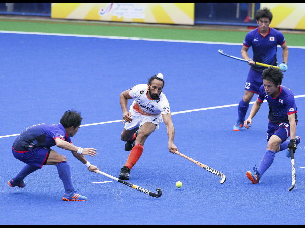 India's Sardar Singh (in white). India's Sardar Singh (in white).