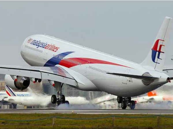 Malaysia Airlines returns after passenger threatens to detonate a bomb Malaysia Airlines returns after passenger threatens to detonate a bomb
