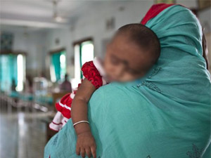 A baby carried by its mother in WB hospital