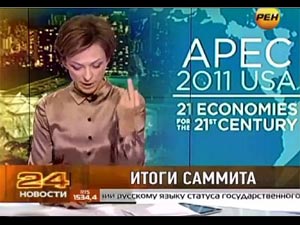 Russian newsreader showing the rude gesture