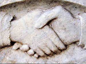Handshake sculpted on stone