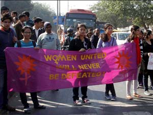 JNU students holding a banner