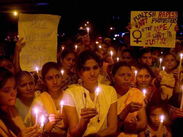 People Take part in Candle Light