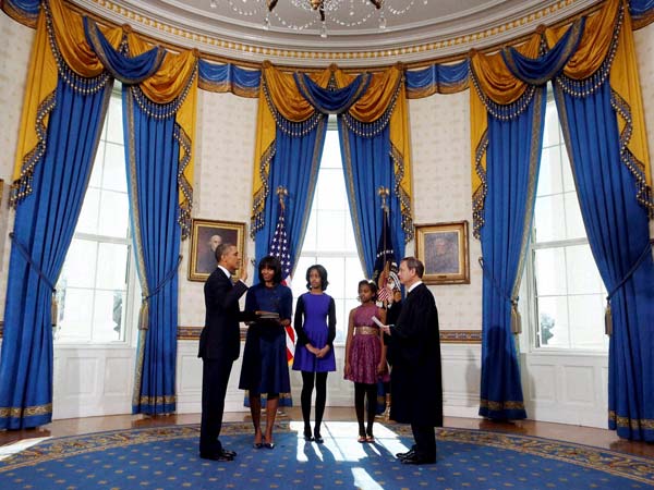 Barack Obama is officially sworn-in by Chief Justice John Roberts in the Blue Room