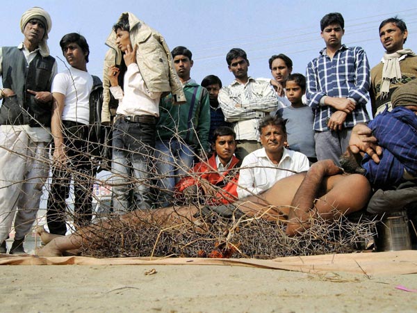 A Sadhu sleeping on thorns