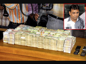 Guj: Bookie held, Rs 1.28 cr,gold seized
