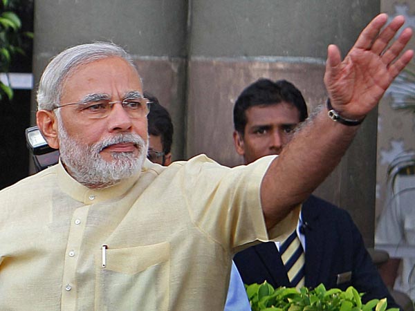 Narendra Modi waves to supporters