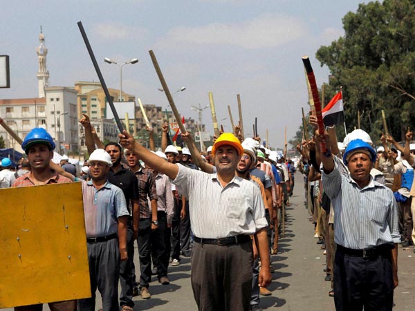 Supporters of President Morsi march in Cairo