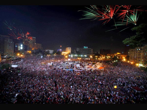 Fireworks light the sky as opponents of Egypt's Islamist President