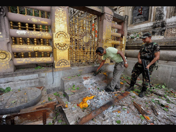 Security personnel inspecting the explosion site