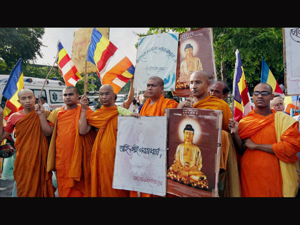 Buddhist Monks take part in a silent protest