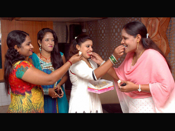 Bar girls celebrate with sweets