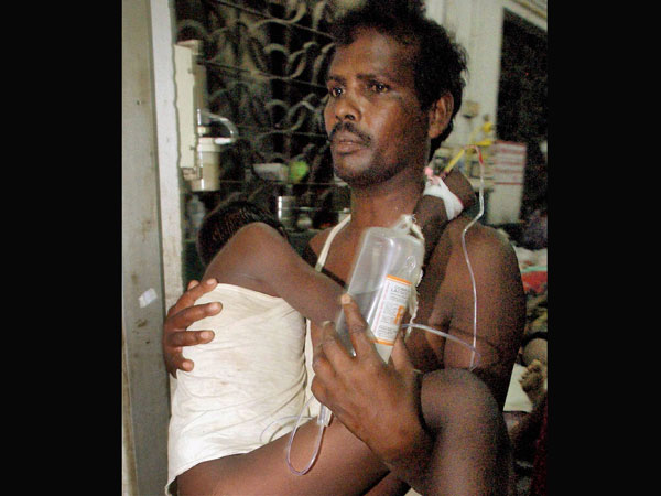 A man hold his ill child