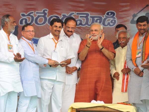 With Venkaiah Naidu and others