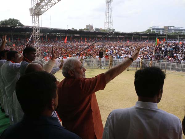 Greets audience